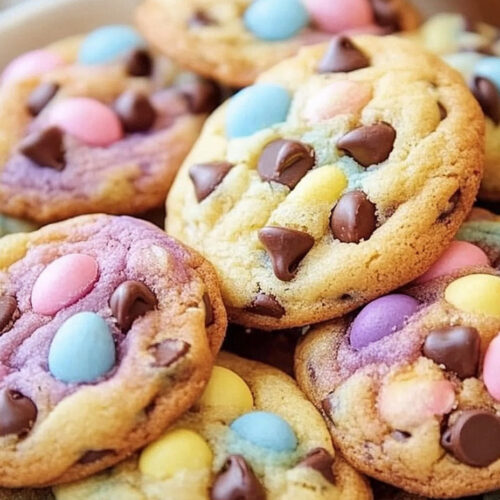 A plate of freshly baked Easter chocolate chip cookies with pastel-colored candies